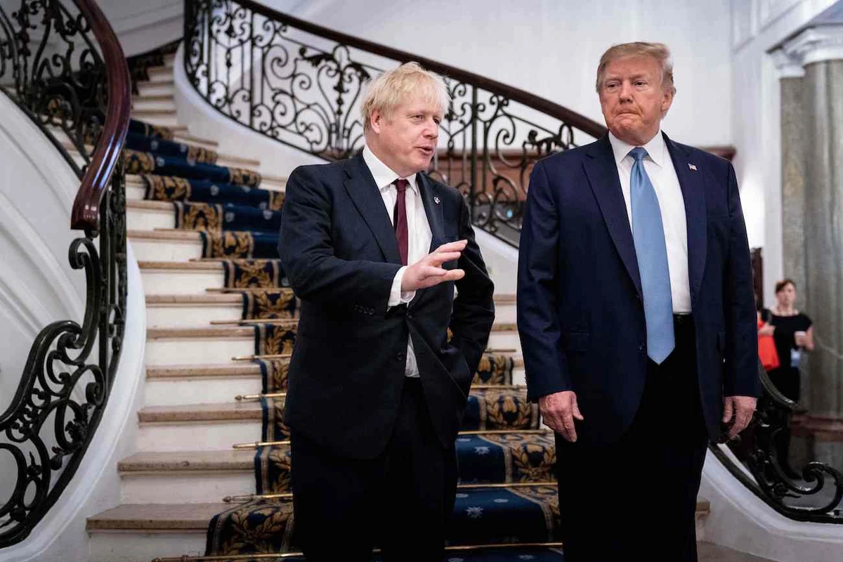 US President Donald Trump (R) and Britain's Prime Minister Boris Johnson speak before a working breakfast at the G7 Summit in Biarritz, France on August 25, 2019. (AFP)