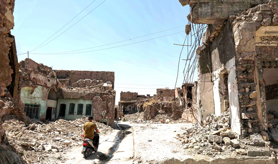 Finding homes in ruin, destitute Iraqis return to camps