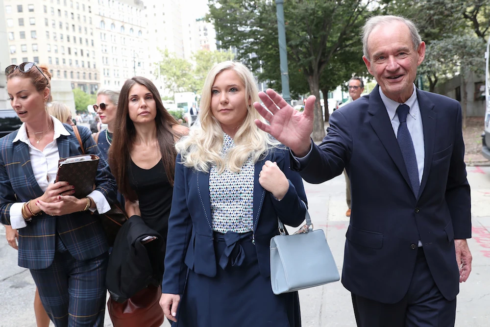 Lawyer David Boies arrives with his client Virginia Giuffre for hearing in the criminal case against Jeffrey Epstein, who died this month in what a New York City medical examiner ruled a suicide, at Federal Court in New York, US, August 27, 2019. (Reuters)