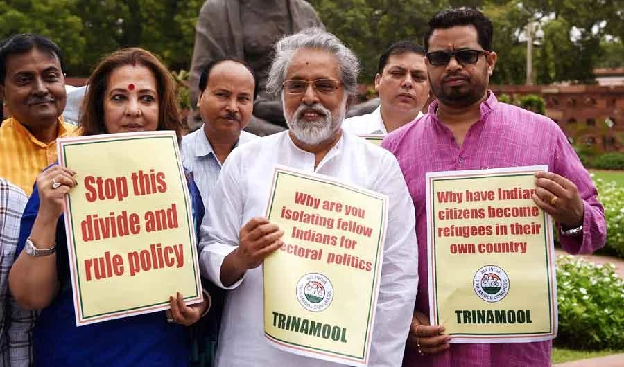 The All India Trinamool Congress (TMC) Members of Parliament hold placards against the non-inclusion of over 40 lakh people in Assam's National Register of Citizens during a protest in Parliament in New Delhi on July 31, 2018. (AFP)