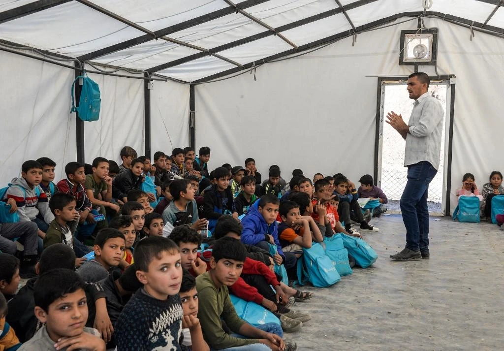 Most of the displaced families are undocumented, which means their children will not be able to go to school once they are back in Hawija. (File/AFP)