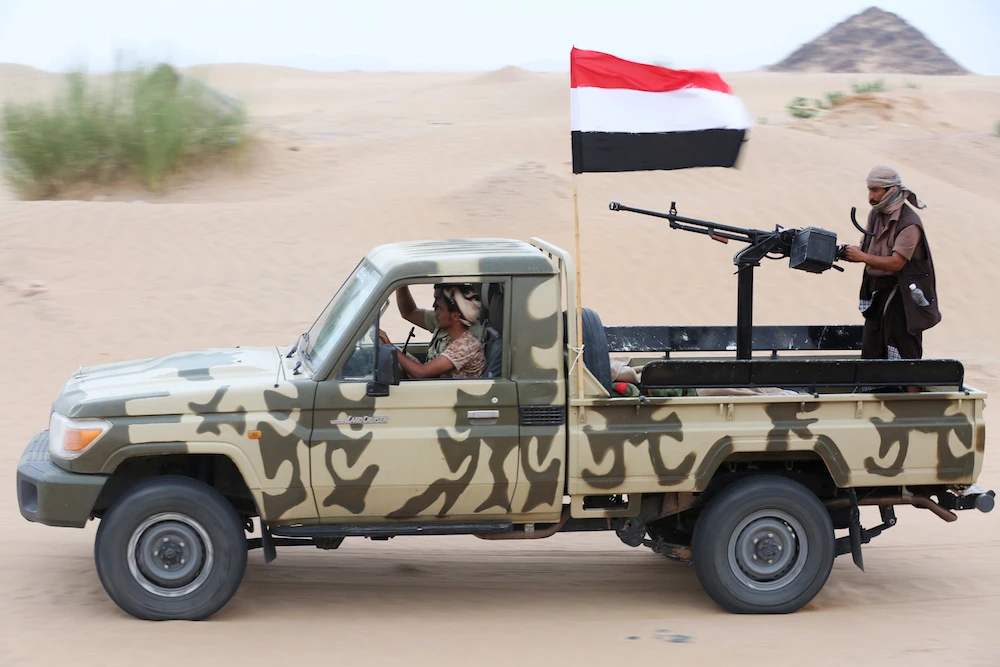 Pro-government soldiers patrol an area taken by government forces during recent clashes with southern separatists in Shabwa province. On Wednesday, government forces declared it had retaken Aden. (AFP)