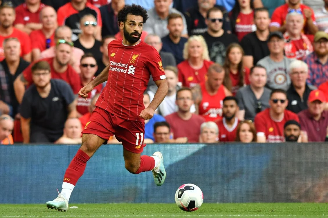 Liverpool's Egyptian midfielder Mohamed Salah runs with the ball during the English Premier League football match between Liverpool and Arsenal at Anfield. (AFP)