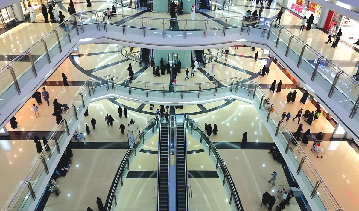 Shoppers in search of bargains at the Al-Qasr mall in Riyadh. Government programs and incentives are helping to boost consumption in the Kingdom, according to a new report. (Shutterstock)