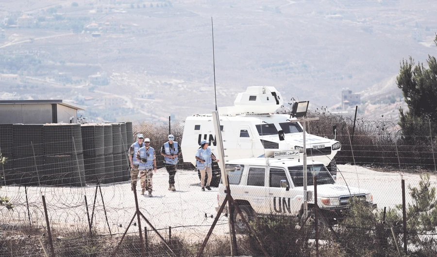 UN peacekeeping troops are seen on the Lebanese side of the border with Israel, as seen from the Israeli side near Kibbutz Menara. (Reuters)