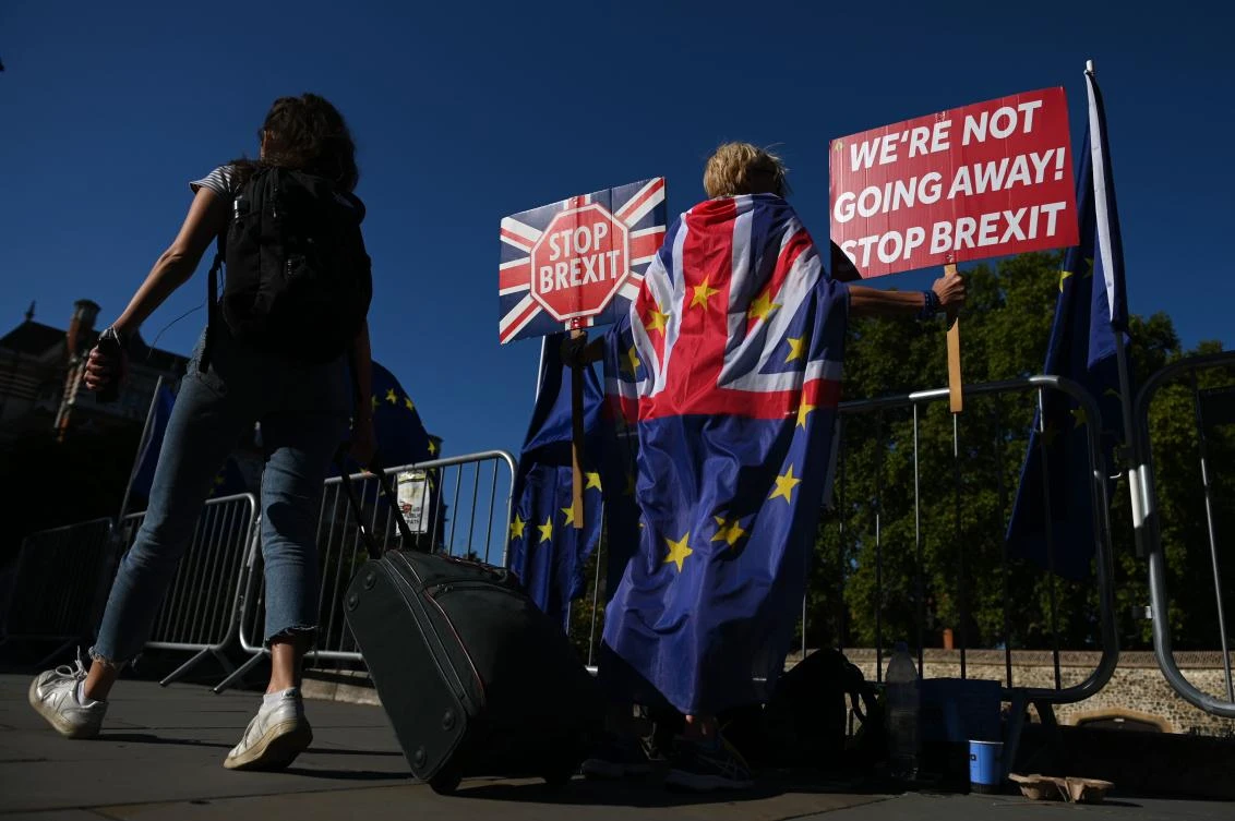 Anti-Brexit demonstrators stand outside Parliament in London on August 29, 2019. (File/AFP)