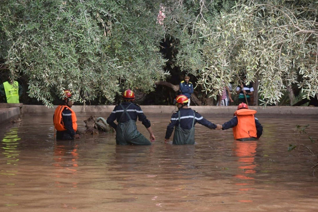 Moroccan autorities look for bodies in a river near the southern village of Tizert in the Taroudant region. Seven people were killed when a river burst its banks and flooded a village football pitch. (AFP)