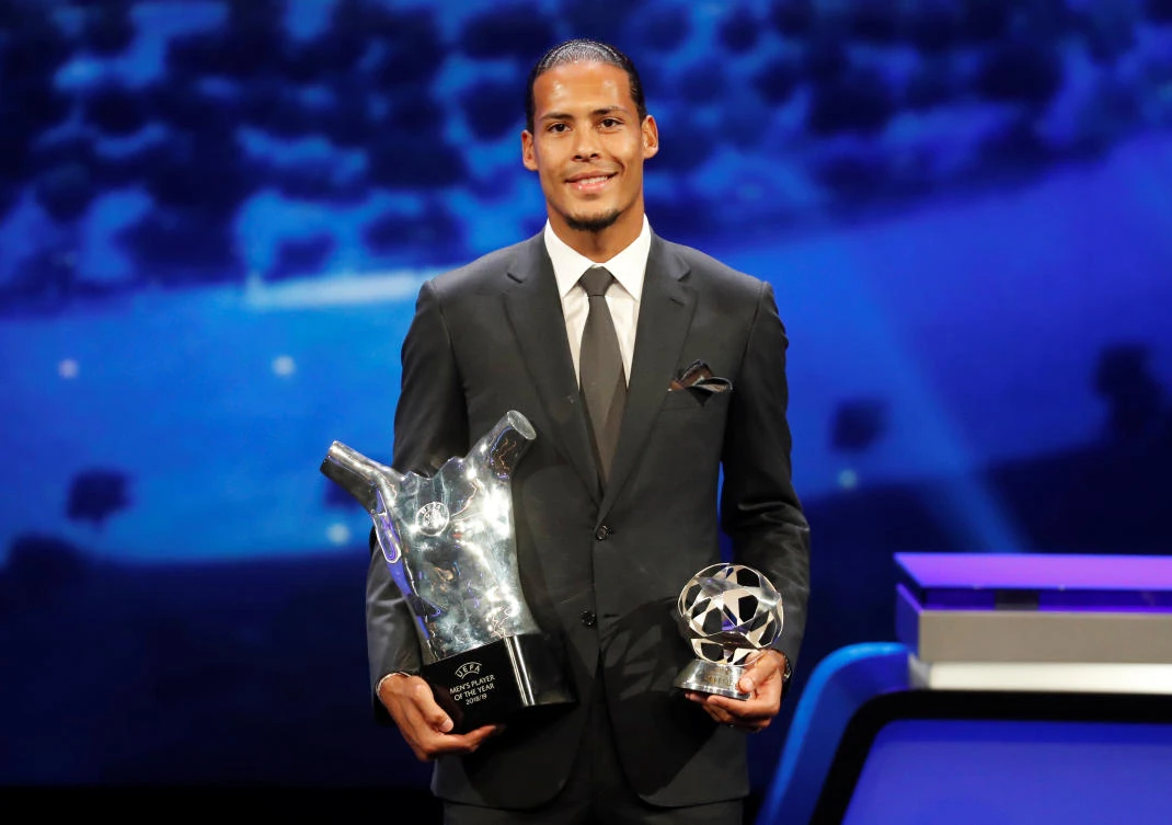 Liverpool’s Virgil van Dijk with the UEFA Men’s Player of the Year and Champions League Defender of the Season awards. (Reuters)