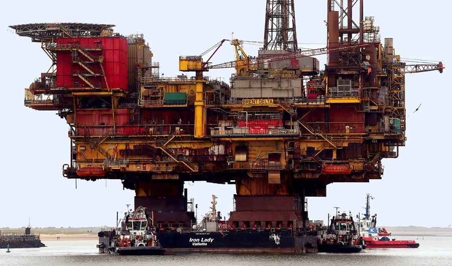 Brent oil holds above $60 as lower inventories boost WTI