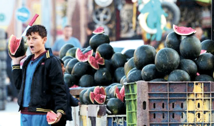 A Palestinian sells produce in Gaza City as internal political division leads the country to povery. (AP)