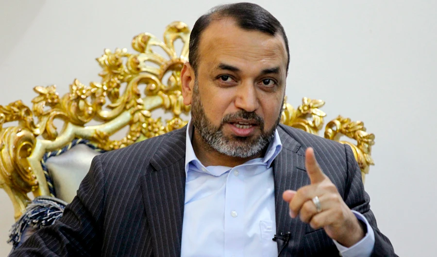 Ahmad Al-Assadi, leading member of the Hashd Al-Shaabi paramilitary force and parliamentarian, speaks during an interview in Baghdad on August 29, 2019. (AFP)