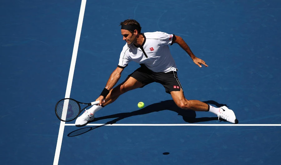 Roger Federer of Switzerland returns a shot during his Men's Singles third round match against Daniel Evans of Great Britain on day five of the 2019 US Open at the USTA Billie Jean King National Tennis Center on August 30, 2019 in New York City. (Clive Brunskill/Getty Images/AFP)