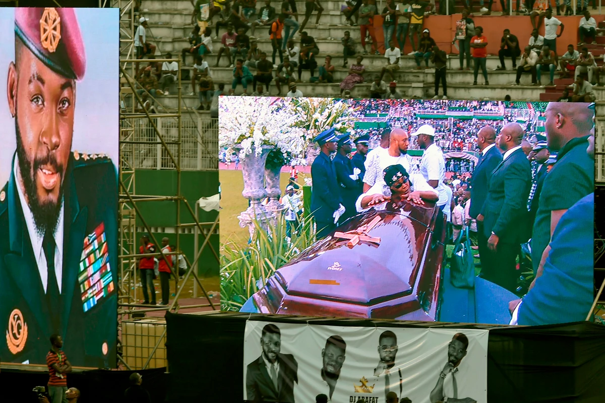 Thousands of fans gathered to pay tribute to DJ Arafat, an Ivorian singer with a huge following in francophone Africa that died at the age of 33, on Aug. 12, after a motorbike crash. (AFP/Sia Kambou)