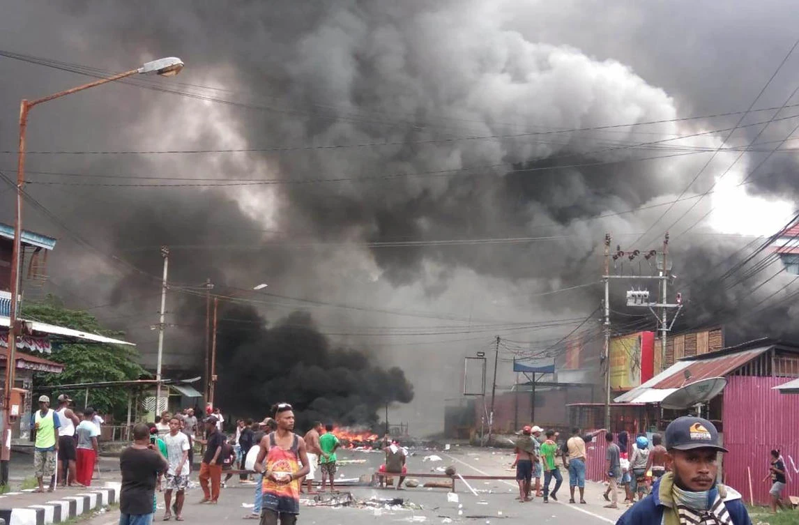Indonesia arrests dozens for Papua protests that set buildings afire