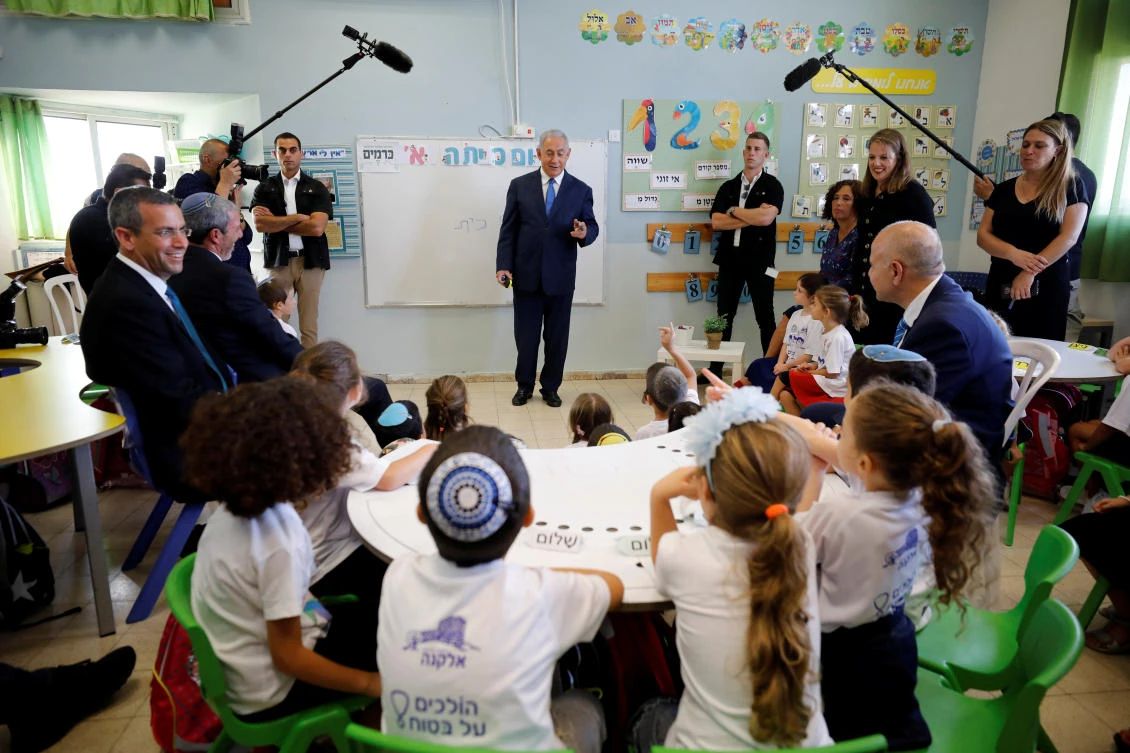 Israeli Prime Minister Benjamin Netanyahu speaks to students during a ceremony opening the school year in the Jewish settlement of Elkana in the Israeli-occupied West Bank. (File/Reuters)