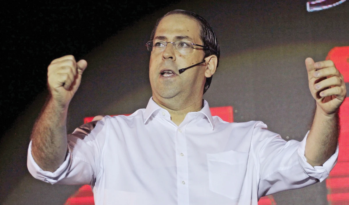 Tunisian former prime minister and presidential hopeful Youssef Chahed during an election campaign in the capital Tunis on Monday. (AFP)