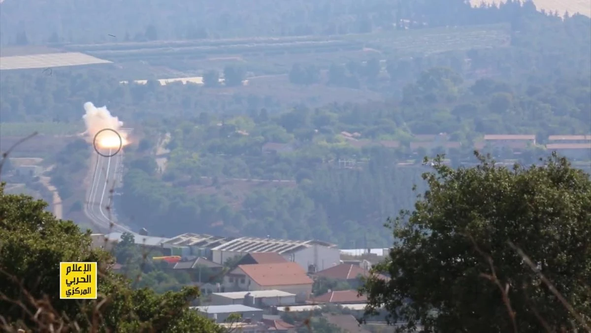 This grab from a video released by the media office of Lebanon's Shiite militant group Hezbollah and broadcast on Al-Manar television on September 2, 2019 reportedly shows footage of the Iran-backed Lebanese group's missile attack against an Israeli military vehicle the day before. (AFP)