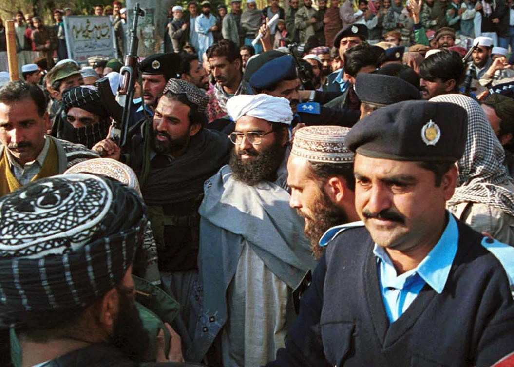 In this Jan. 27, 2000 file photo, Masood Azhar, center, wearing glasses and white turban, leader of Jaish-e-Mohammad arrives in Islamabad, Pakistan. India officially declared on Wednesday, Sept. 4, 2019, that the leaders of two Pakistan-based militant groups are terrorists under a new law. (AP)