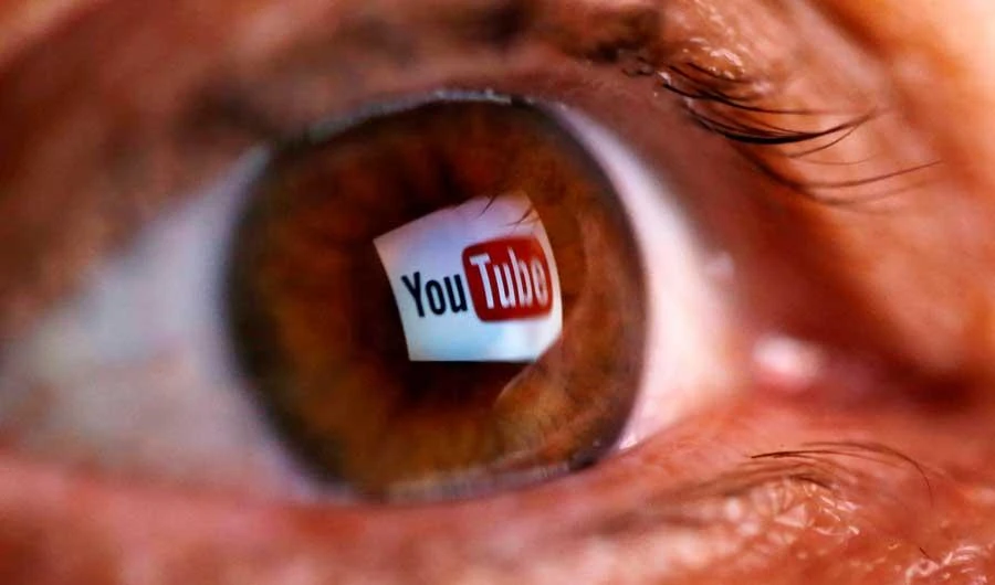 A picture illustration shows a YouTube logo reflected in a person's eye June 18, 2014. (REUTERS)
