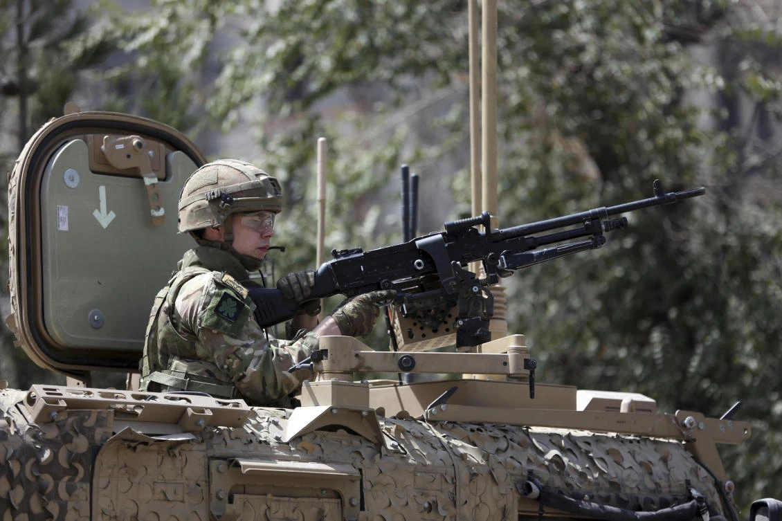 Resolute Support forces guard the site of a car bomb explosion in Kabul on Thursday, September 5, 2019. (AP)