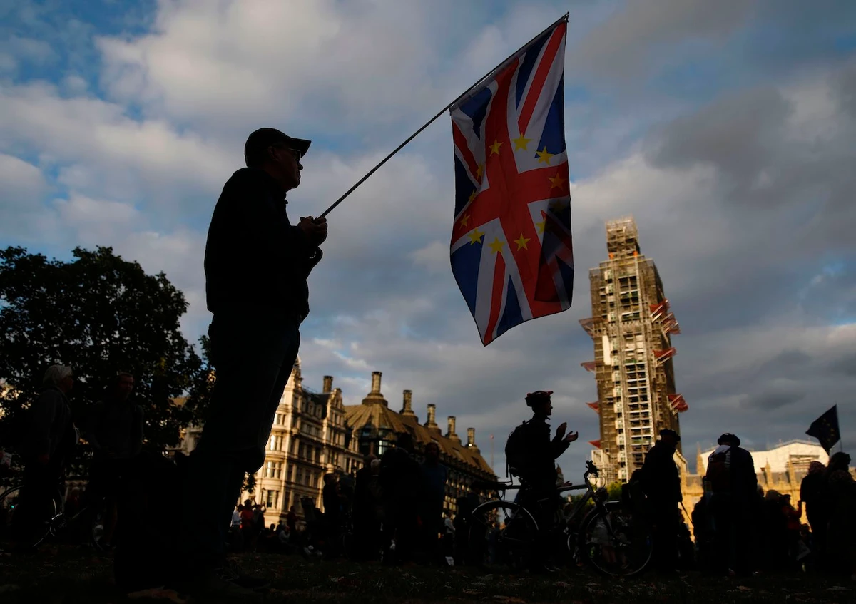 An anti-Brexit protester with a composite Union and EU flag is seen on Parliament Square outside the Houses of Parliament in central London on September 4, 2019. (AFP)
