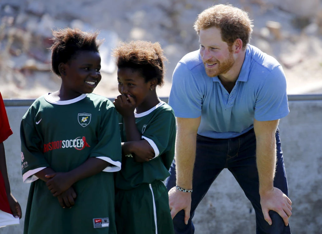 Britain’s Prince Harry takes part in activities with children at the Khayelitsha Football for Hope project in Cape Town, in 2015. (Reuters)