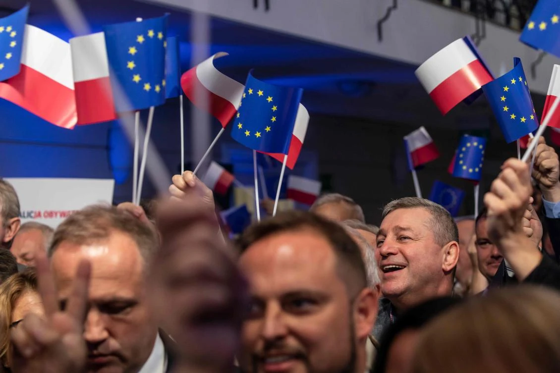 Supporters and candidates of Poland’s main opposition group Civic Coalition (KO, Koalicja Obywatelska) wave flags of Poland and the European Union during a convention to launch their group’s election campaign on September 6, 2019 in Warsaw. (File/AFP)