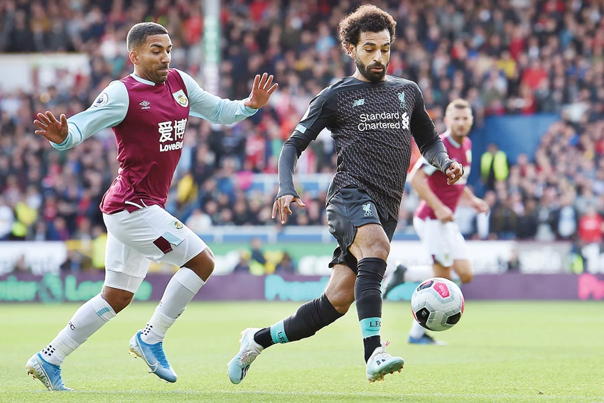 Liverpool’s Mohamed Salah misses a chance as Burnley’s Nick Pope attempts to save during a recent match in England. (Reuters)