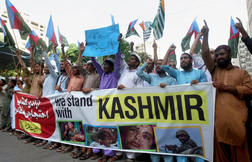 Supporters of a religious students group 'Islami Jamiat-e-Talaba chant slogans during a demonstration to express solidarity with Indian Kashmiris in Karachi, Pakistan, on Sept. 7, 2019. (AP Photo/Fareed Khan)