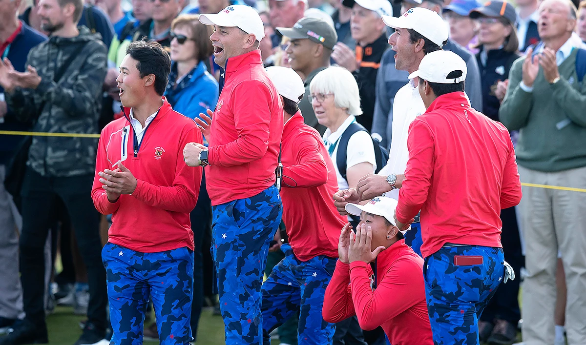 USA Team players watch as Andy Ogletree beats Conor Gough of the Great Britain & Ireland team 2&1 at the Walker Cup golf trophy. (AP)