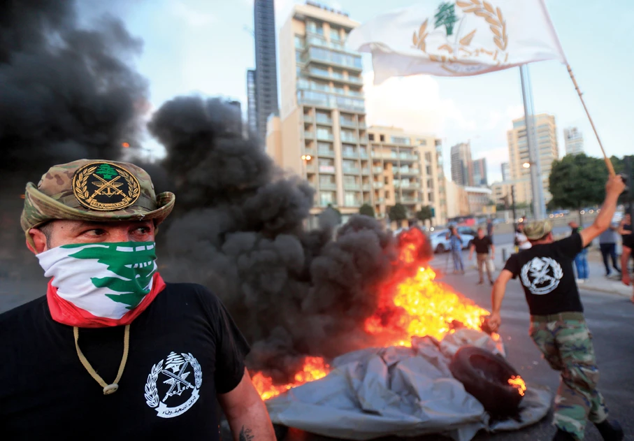 Retired Lebanese security personnel protest over feared pension cuts in the capital Beirut earlier this year, underlining the fragility of social peace in the country. (AFP)