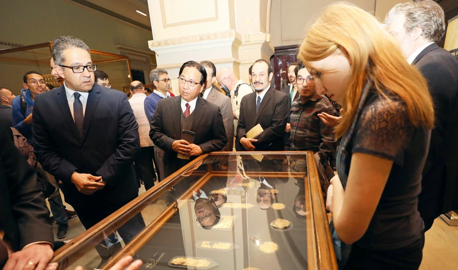 Egyptian Minister of Antiquities Khaled al-Anany looks at exhibits on display during the opening of "Tutankhamun's Unseen Treasures" exhibition at the Egyptian Museum in Cairo, Egypt November 15, 2017.(REUTERS)