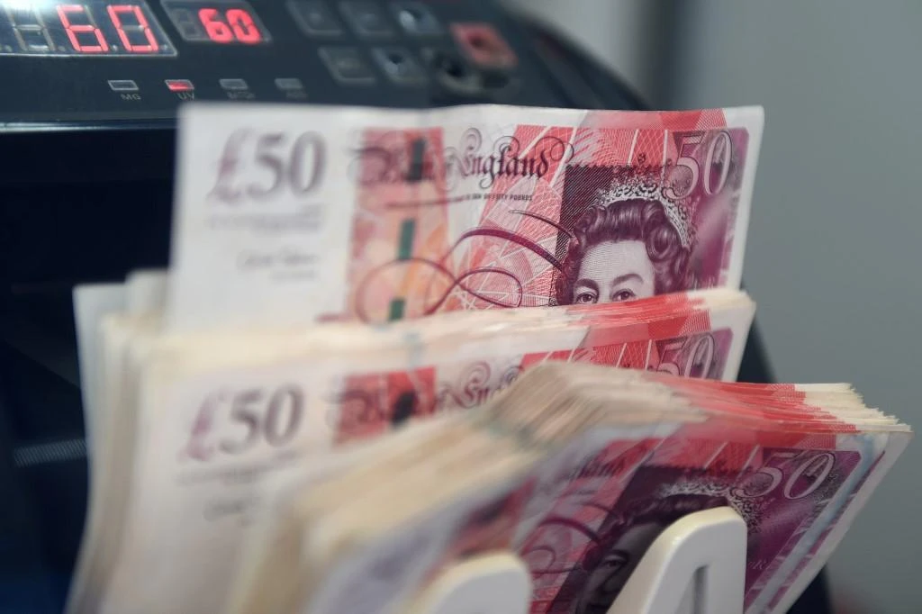 Sterling rebounds on data surprise, Brexit hopes
