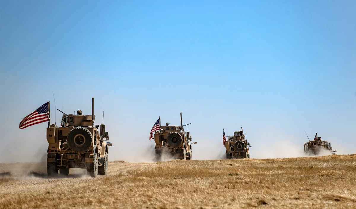 A US military convoy takes part in joint patrol with Turkish troops in the Syrian village of Al-Hashisha on the outskirts of Tal Abyad town along the border with Turkish troops, on September 8, 2019. (AFP)