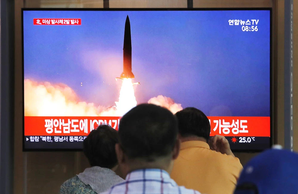 People watch a TV showing a file image of a North Korea's missile launch during a news program at the Seoul Railway Station in Seoul, South Korea, on Sept. 10, 2019. (AP Photo/Ahn Young-joon)