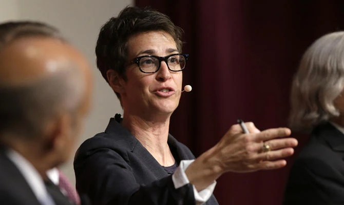 MSNBC television anchor Rachel Maddow, host of the Rachel Maddow Show, is being sued by a conservative television network for calling it "paid Russian propaganda." (AP Photo/Steven Senne, File)