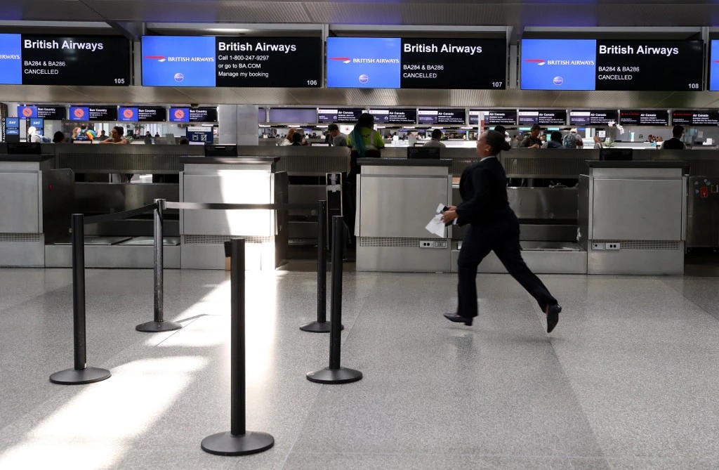 A British Airways ticket counter shows two cancelled flights at San Francisco International Airport on September 09, 2019. A pilot strike entered its second day, with no end in sight. (AFP)