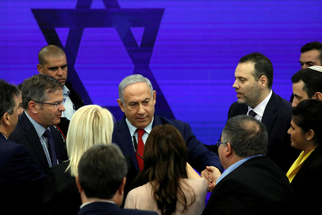 Israeli Prime Minister Benjamin Netanyahu chats with party members after delivering a statement in Ramat Gan, near Tel Aviv, Israel. (Reuters)