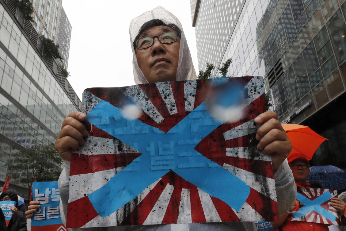 South Korea is calling the Japanese flag a symbol of Japan’s brutal wartime past. (AP)