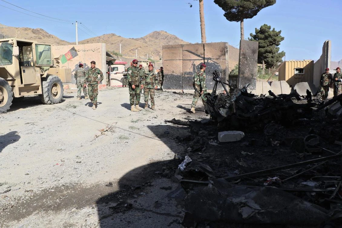 Afghan National Army (ANA) solders inspect the site of a suicide car bomb attack near a base of elite Afghan special forces in Char Asiab district, south of the capital Kabul on September 12, 2019. (AFP)