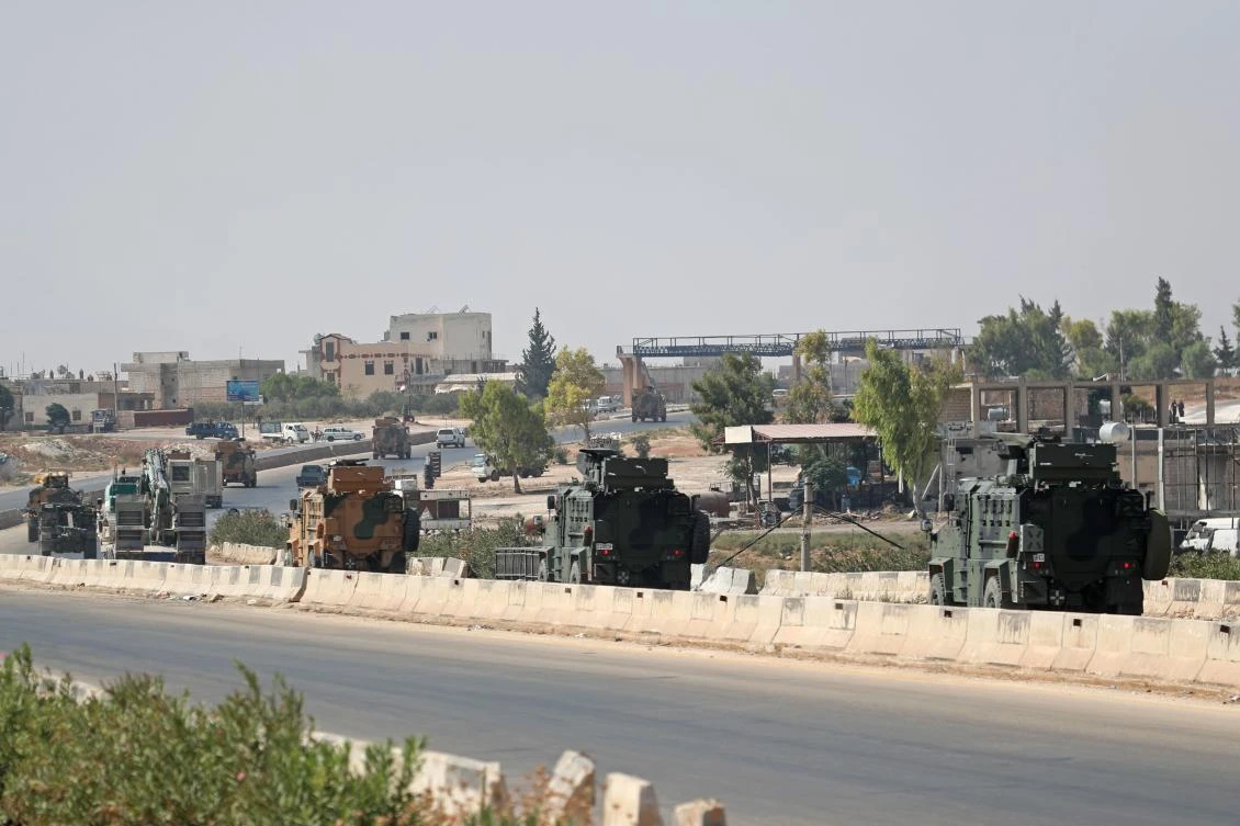 A Turkish military convoy heads towards an observation point near the town of Maar Hitat in Syria's northern Idlib province on September 12, 2019. (AFP)