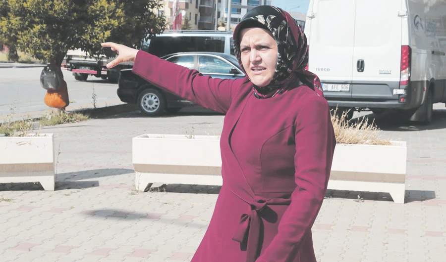 Sumeyye Yilmaz explains how her husband, Mustafa Yilmaz, was taken by men outside the family home in Ankara. (AFP)