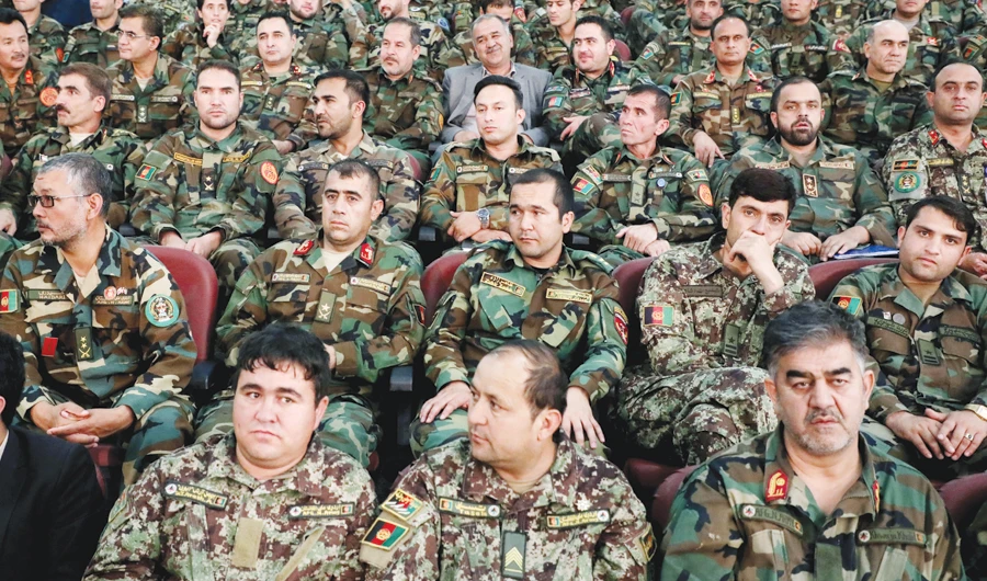 Afghan army officers listen to a speech by President Ashraf Ghani during a recent conference in Kabul as insurgents continued to stage violent attacks. (Reuters)
