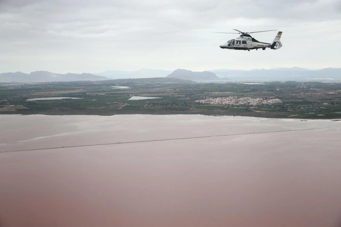 A handout picture released by the press office of the Spanish premier on September 14, 2019 shows a helicopter flying over flooded areas near Orihuela. (File/AFP)