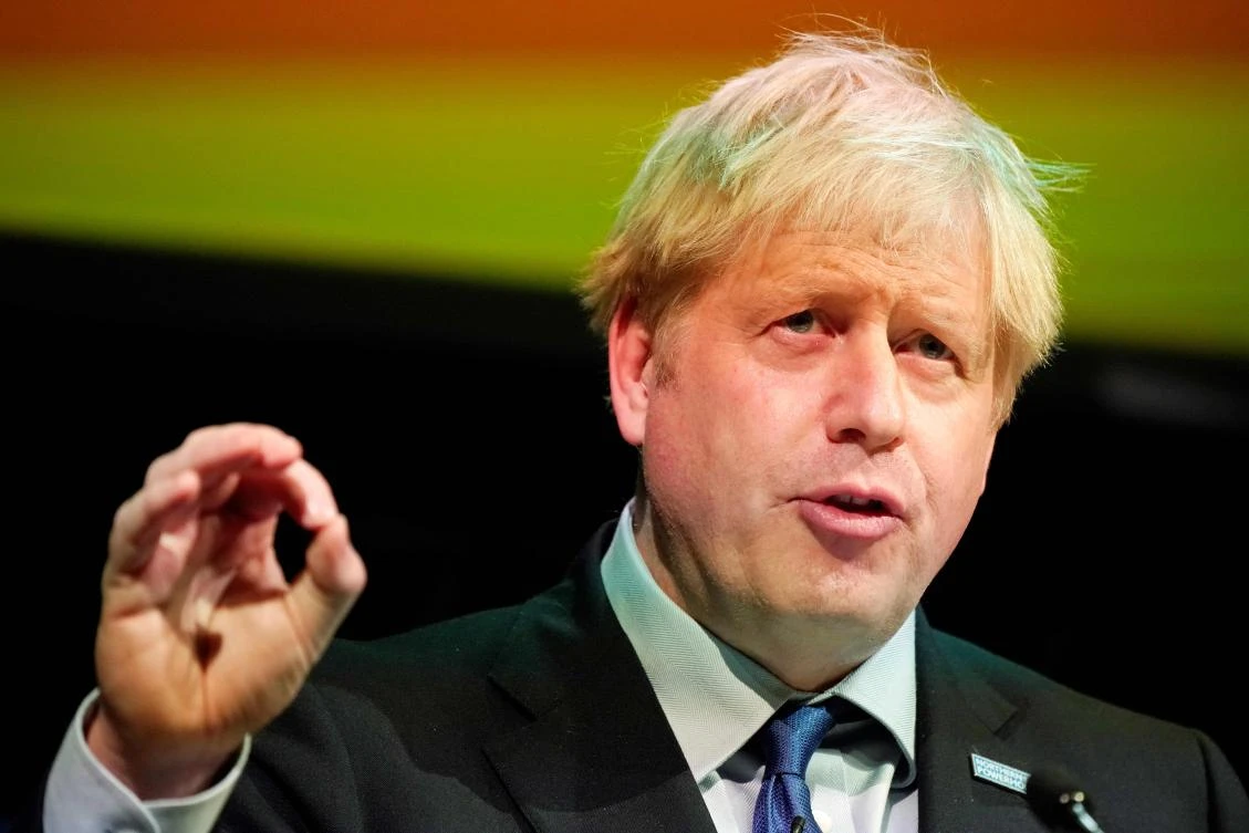 Britain's Prime Minister Boris Johnson gestures as he delivers his speech at the Convention of the North, in the Magna Centre in Rotherham, norhtern England on September 13, 2019. (AFP)