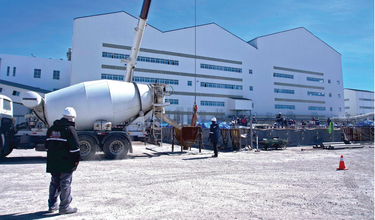 Employees work at a lithium extraction complex in Uyuni Salt Flat, Bolivia. (AFP)