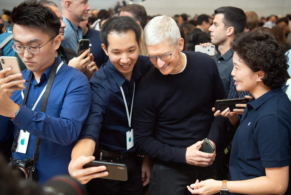 Apple CEO Tim Cook poses for a selfie during an Apple product launch event at Apple's headquarters in Cupertino, California on September 10, 2019. ( AFP / Josh Edelson)