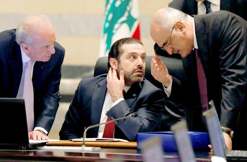 Lebanese Finance Minister Ali Hassan Khalil, right, and Prime Minister Saad Hariri, centre, during a cabinet meeting in Beirut. (Reuters)