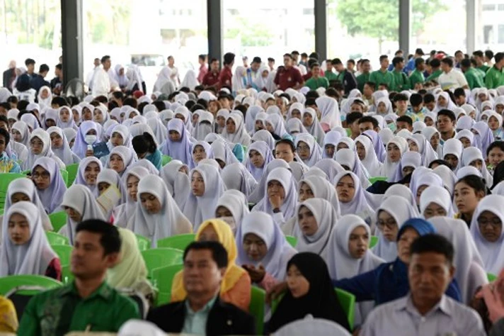 Thai Muslim students and faculties of Princess of Naradhiwas University attend a university sponsored forum presenting various political party candidates in Thailand’s southern province of Narathiwat. (AFP)