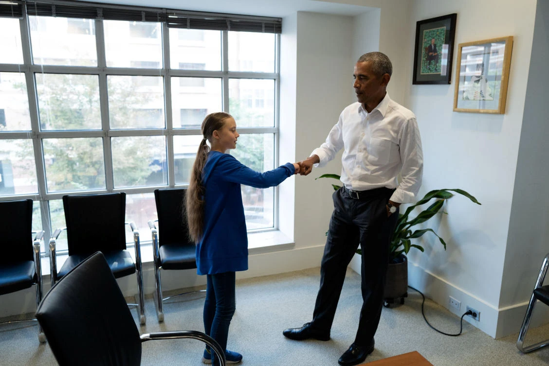 Former US President Barack Obama fist bumps Greta Thunberg during a meeting at his personal office in Washington, D.C. (Reuters)
